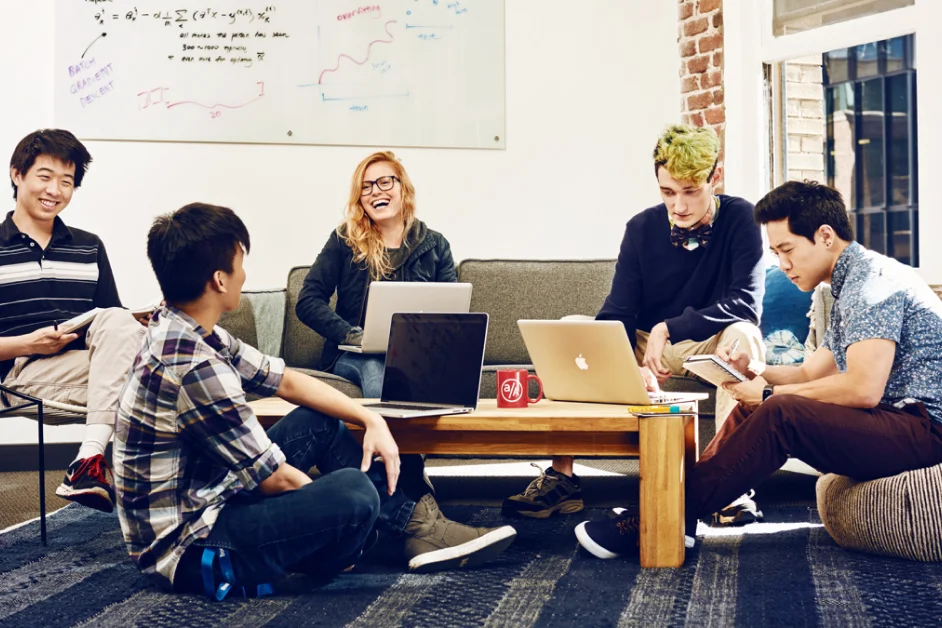 app academy students sitting around a table