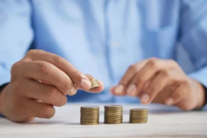 a person stacking coings