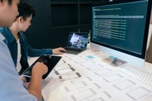 two people working on a laptop