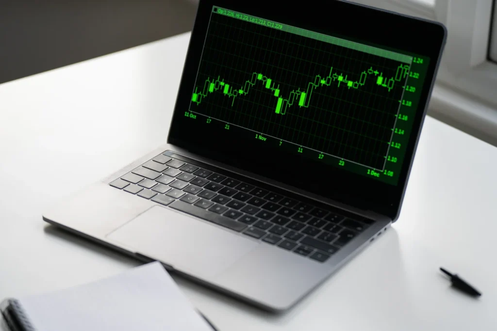 laptop with finance information on the screen