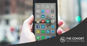 hand holding an iphone on the street
