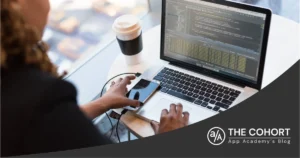 woman working on a laptop with a cup of coffee