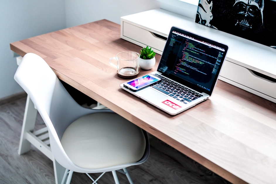 a desk with a laptop on it