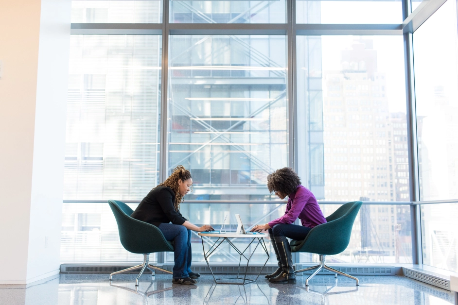 two people sitting talking over a table