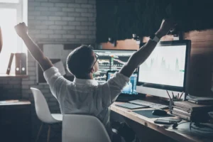 person sitting next to a computer