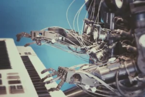 a robot sitting down playing keys