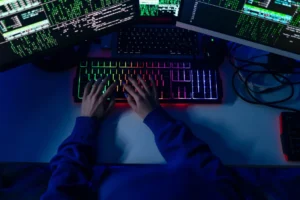 person coding on a computer