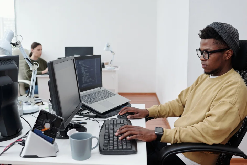 man working on his laptop in an office