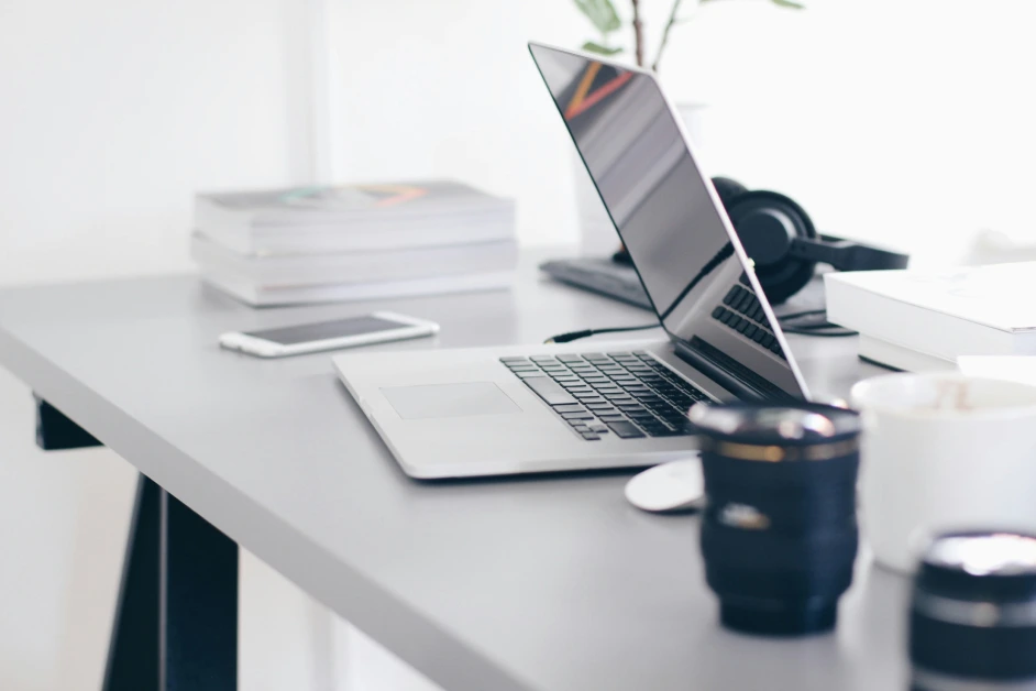desk with a laptop open on it