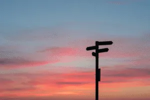 sunset sunrise sky signs pointing different directions