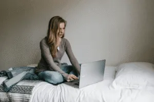 woman working from her bed