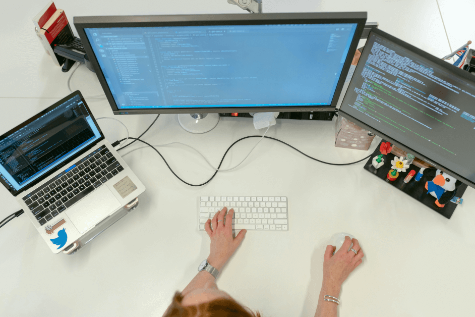 software developer three monitors